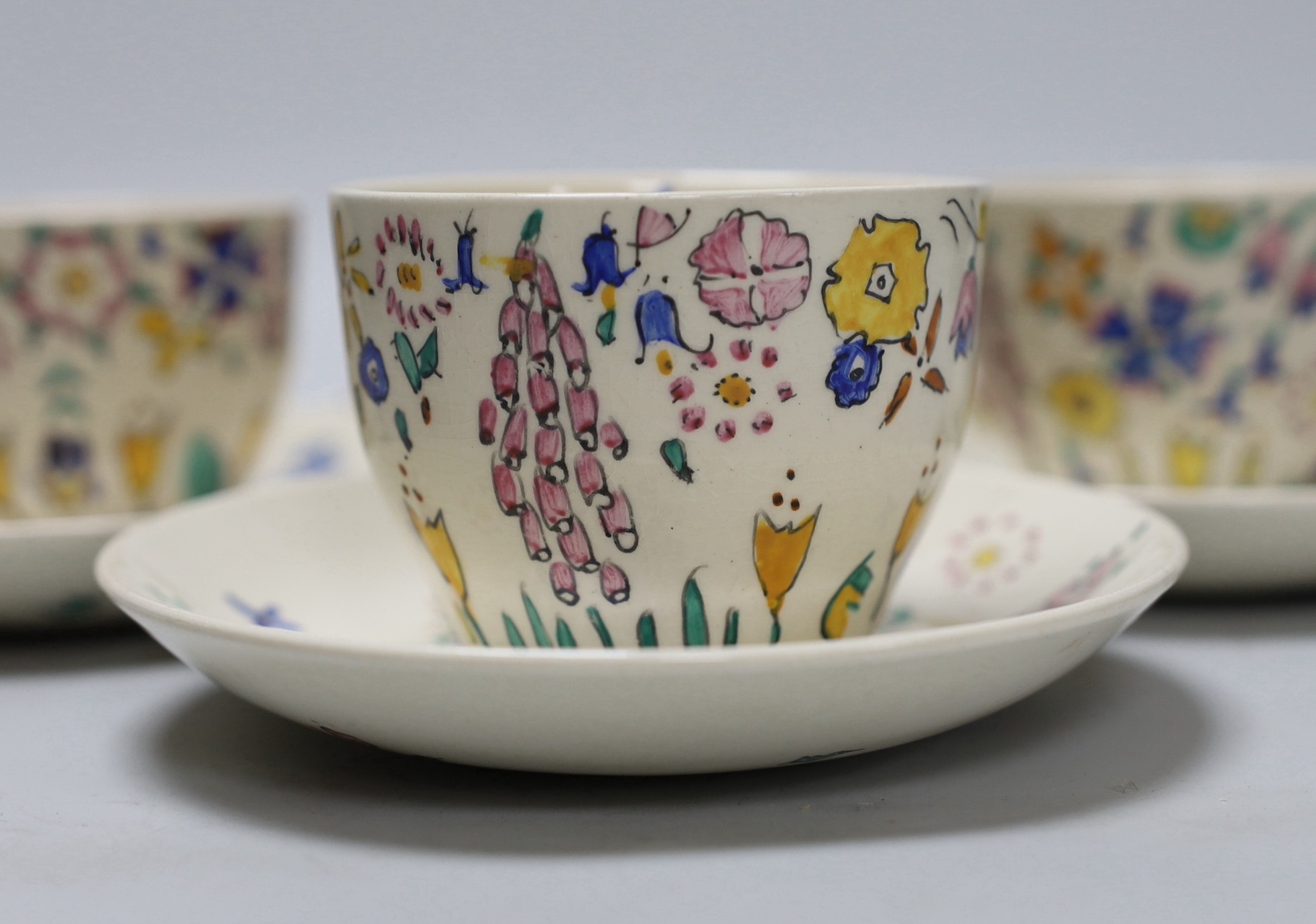 Jessie Marion King. A set of six floral teacups and saucers